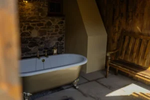 Interior of the private outdoor bath house at Gablebach Cottage