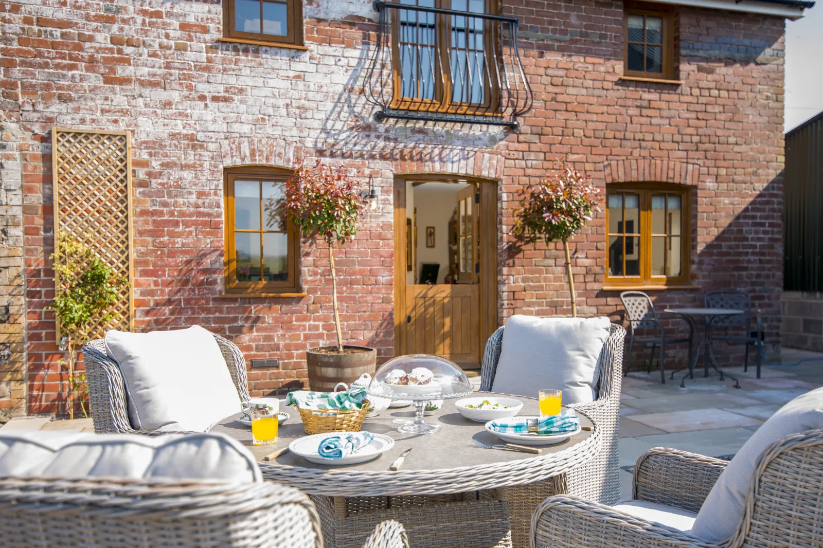 Outdoor breakfast on the patio at Gablebach cottage overlooking the Welsh countryside.