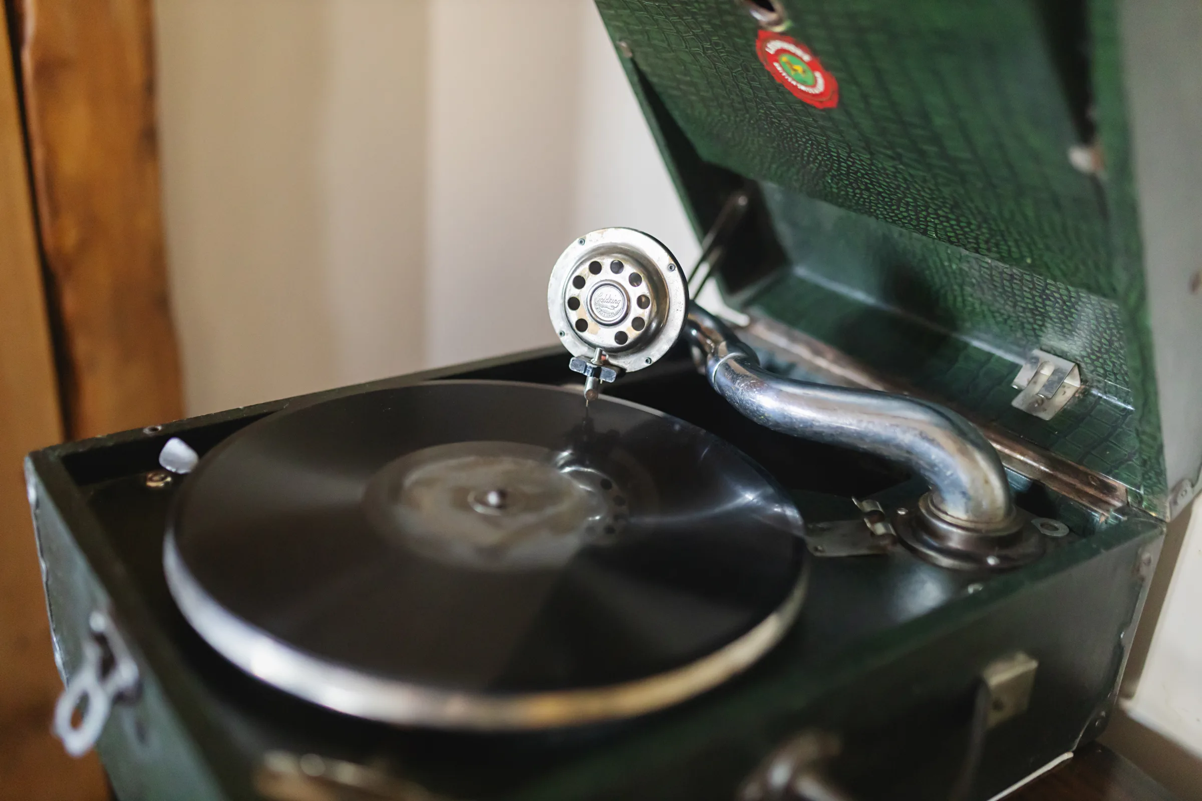 Vintage record player and antique furnishings inside Gablebach cottage