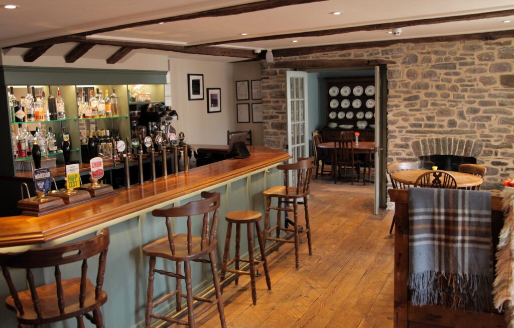 The restored Georgian bar at Y Castell in Llangadog with traditional interiors and Welsh drinks.